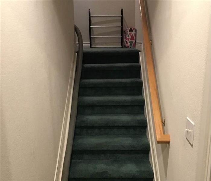 Staircase with wet carpets.
