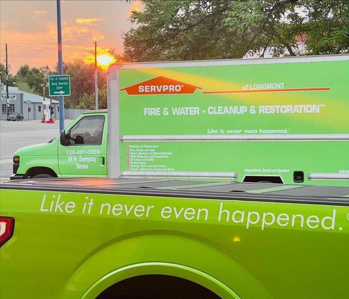 Two SERVPRO vehicles infront of the sunrise.