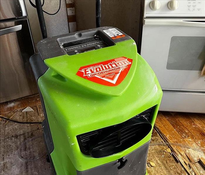 Dehumidifier standing in a kitchen.