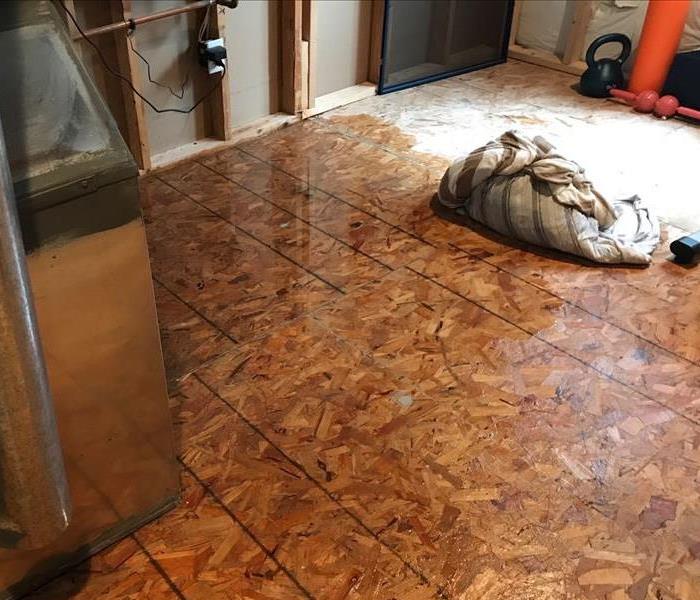 water damaged flooring after pipe burst